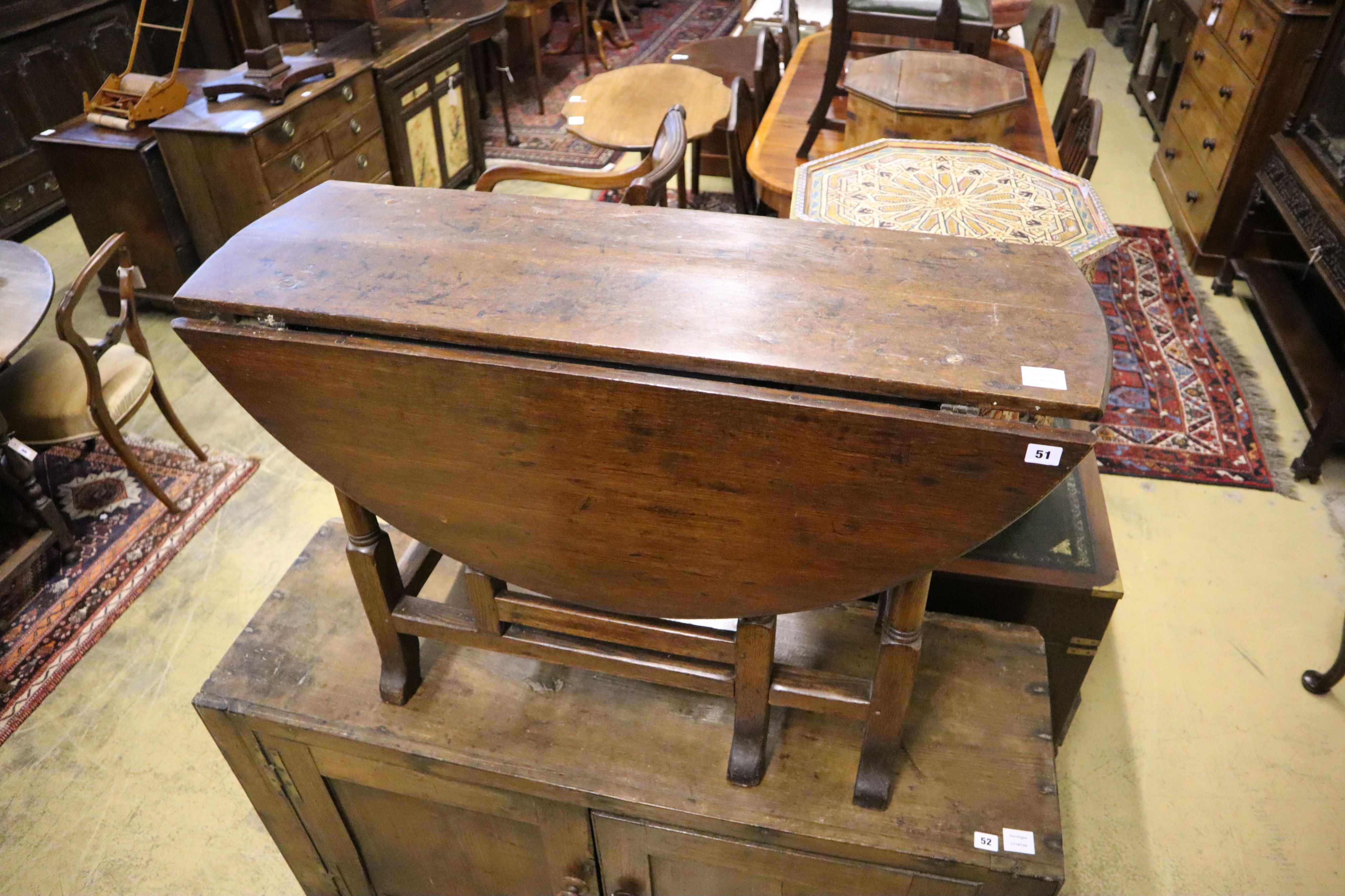 An early 18th century oak gateleg table, width 105cm, depth 38cm, height 70cm